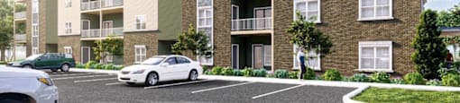 A modern apartment building with cars parked in front.