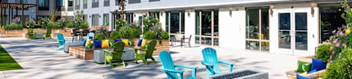 a large open area with benches and chairs in a building