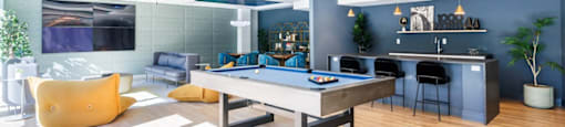a game room with a pool table and a bar