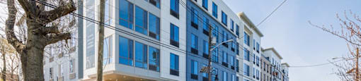 a large blue and white building on a city street