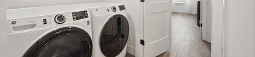 A laundry room with a washer and dryer.