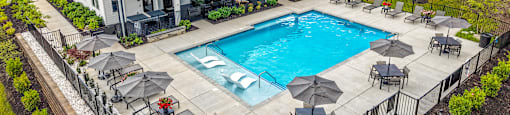 A pool area with a building that has a sign that says "Steel Island".