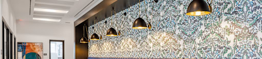 a restaurant with white tables and blue chairs and a blue wall