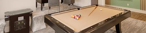Billiard and gaming room with billiard table, Foosball and chairs