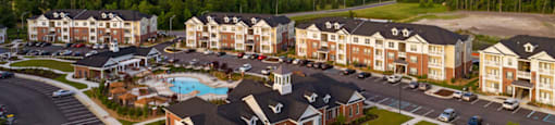 Apartment buildings and parking lot; community clubhouse and pool