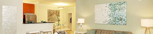 Living room with ceiling fan, carpet; open to kitchen