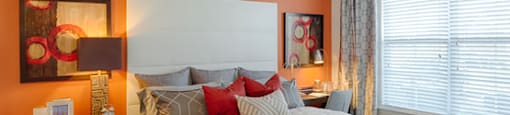 Bedroom with ceiling fan, carpet and window