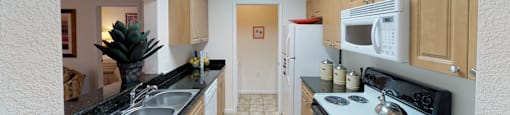 Kitchen with laundry room; open to living room
