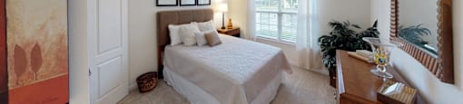 Bedroom with window; carpet