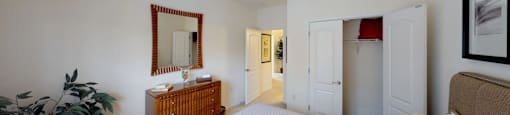 Bedroom with closet; hallway bathroom