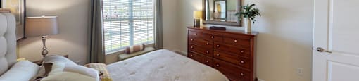 Bedroom with window; carpet