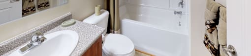 Bathroom with sink, toilet, shower and tub
