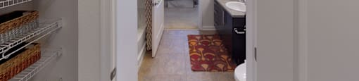 Walk-in closet leading into bathroom; inside main bedroom