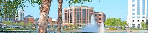City Center benches overlooking fountain; office buildings and shops