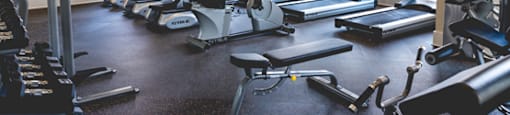 Fitness center with cardio equipment; flat screen TV