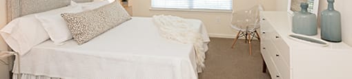 Bedroom with window; carpet