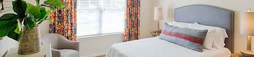Bedroom with window; carpet