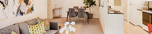 Living room with couch and chair; separate dining room; galley kitchen