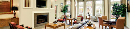 Clubhouse with chairs and fireplace