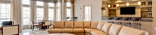 Leasing office with seating; bar area with flat-screen TV