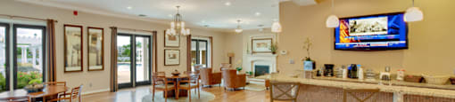 Clubhouse with bar area; flat screen TV; tables and chairs; fireplace