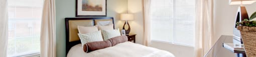 Bed with windows on either side