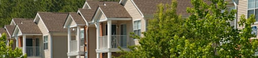 Apartment building exterior; trees