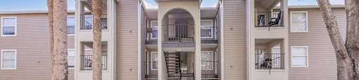 our apartments have a spacious courtyard with grass and trees
