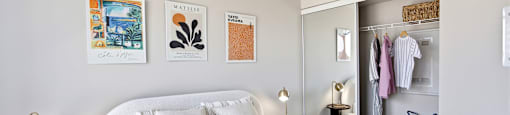 A bedroom with a large bed and a wardrobe.