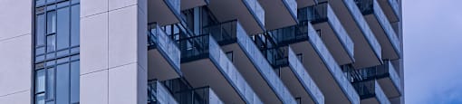 A tall building with a sign that says "MOTION" on the bottom.