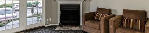 a living room with two couches and a fireplace