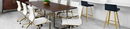 A modern dining room with a wooden table and white chairs at The Port at East Beach Apartments and Marina in Norfolk, VA, 23518
