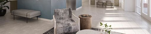 a lobby with a chair and a table at The Port at East Beach Apartments and Marina, Virginia
