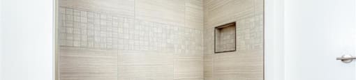 a bathroom with a bath tub and a shower at The Port at East Beach Apartments and Marina, Virginia, 23518