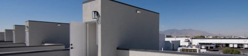 the roof of the building with the sky in the background