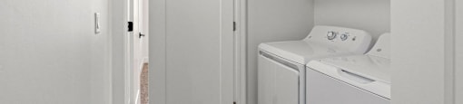 a laundry room with a washer and dryer