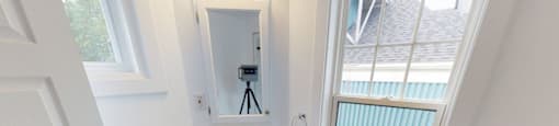 A bathroom with a sink and a window.