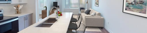 A kitchen with a marble countertop and a dining area with a sofa.