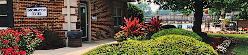 a building with a garden in front of it