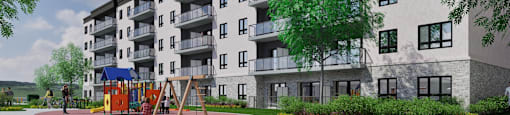 A large apartment building with a playground in front.