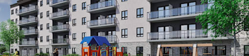 A playground with a slide and a swing set in front of apartment buildings.