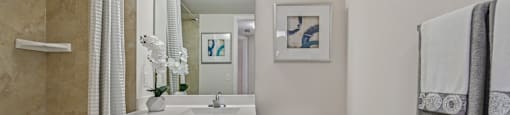 A bathroom with a toilet, sink, and bathtub.