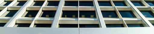A tall building with the word "ONE" on the side.