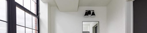 A white toilet sits next to a sink in a small bathroom.