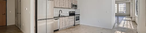 A kitchen with white appliances and a wooden backsplash.