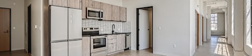 A kitchen with a white fridge and a white oven.