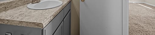 an empty bathroom with a sink and a mirror at Raleigh Rentals, North Carolina, 27604