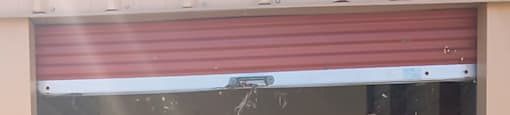 A storage unit with the door open and number 10 visible.