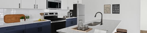 A kitchen with a white countertop and a sink.
