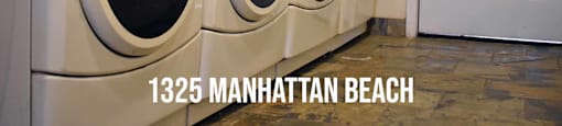 Community laundry area with multiple washers and dryers